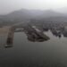 An aerial view of a harbor with boats docked in it, showcasing the bustling business news.