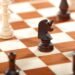 Business news about chess pieces on a chess board.