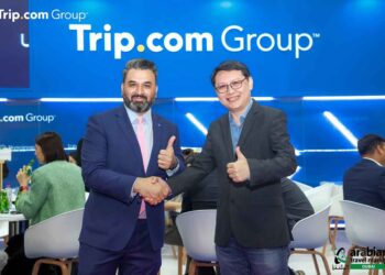 Siddharth Sudhakar and Boon Sian Chai at the Trip.com Group booth at ATM.