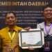 Bahrani Hasanal, Head of the East Kutai Health Department (left). Credit: East Kutai Govt PR