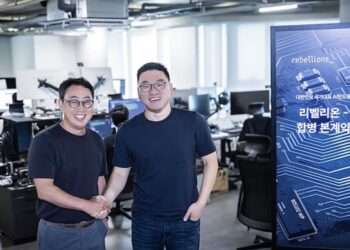 Ryu Young-sang, SKT CEO (left) shook hands with Park Sung-hyun, Co-founder and Rebellions CEO. Credit: SK Telecom