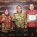 Southeast Sulawesi Acting Governor Andap Budhi Revianto (center) received UHC Award. Credit: Southeast Sulawesi Provincial Govt