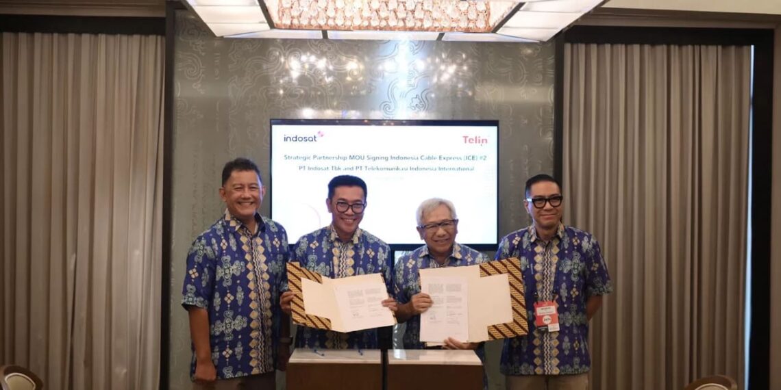 Representatives from Telin and IOH signed a strategic cooperation agreement on developing telecom infrastructure at BATIC 2024, held in Nusa Dua, Bali (08/28). Credit: Telin