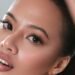 A model using Hue contact lenses in espresso brown. Credit: Hue