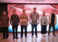 (3rd from left)