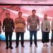 (3rd from left)